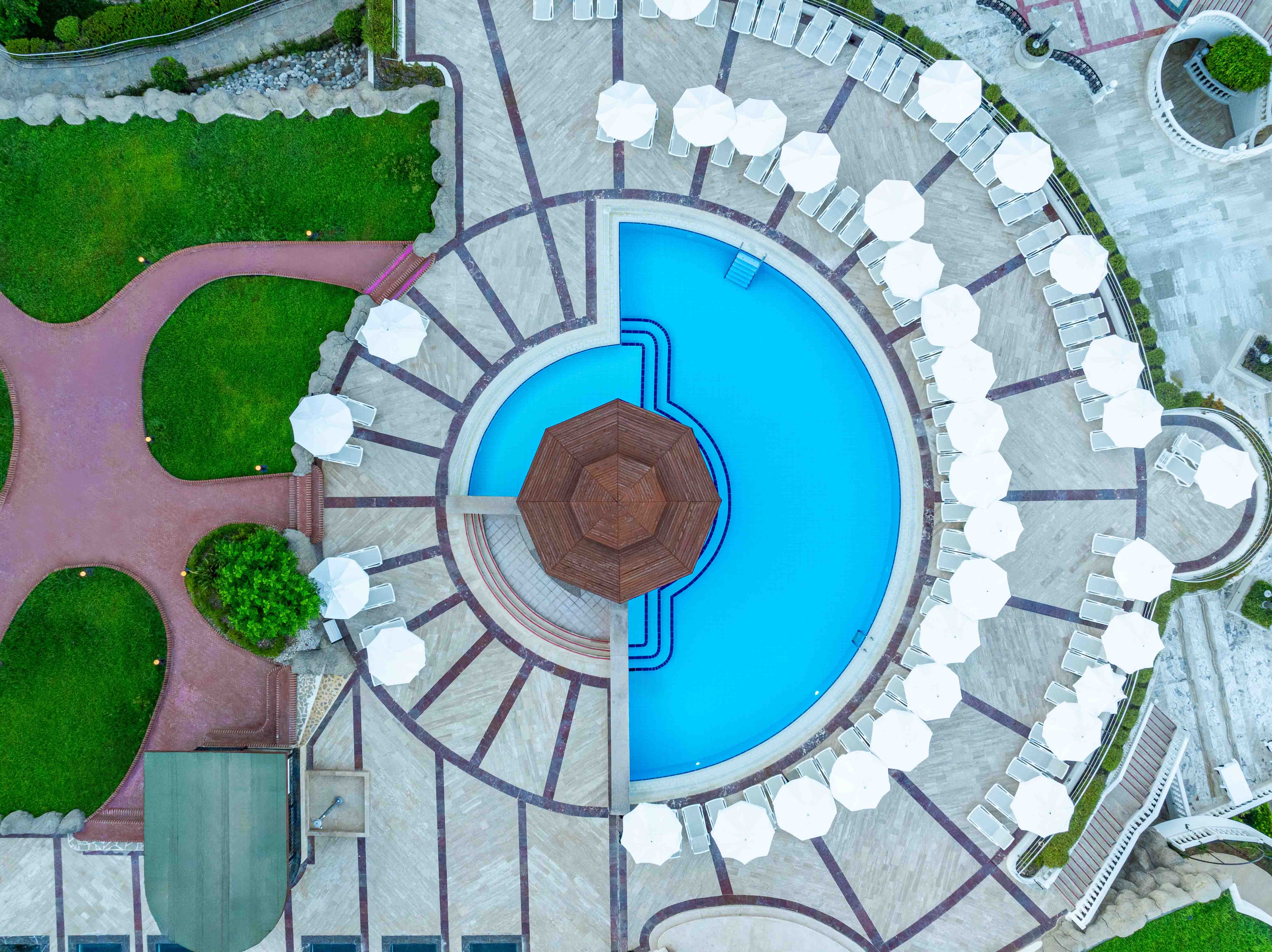 Curved pools, paths and gardens viewed from above.